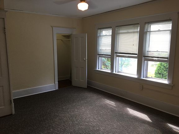 Large master bedroom with lots of windows
