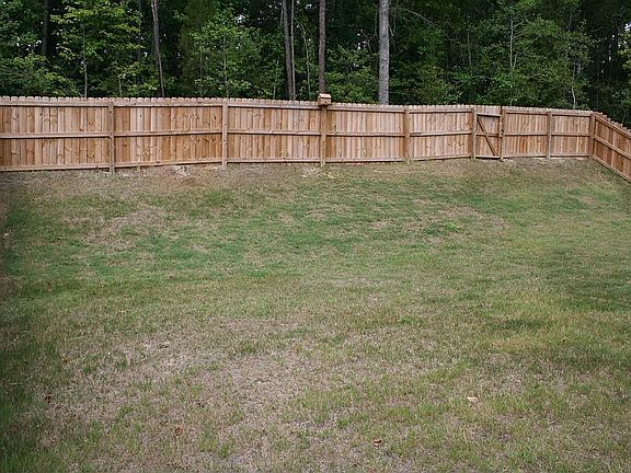 Private backyard with full fence.