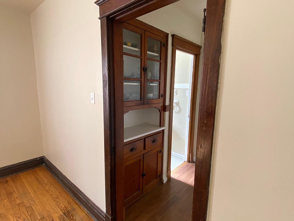 Hallway from kitchen with built in storage