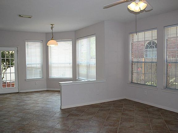 Family den opens to morning area and kitchen.