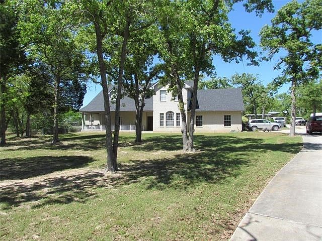 Front south view from Evergreen driveway entry.