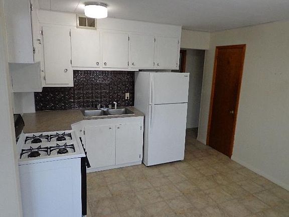 kitchen and doorway to laundry area and bedrooms