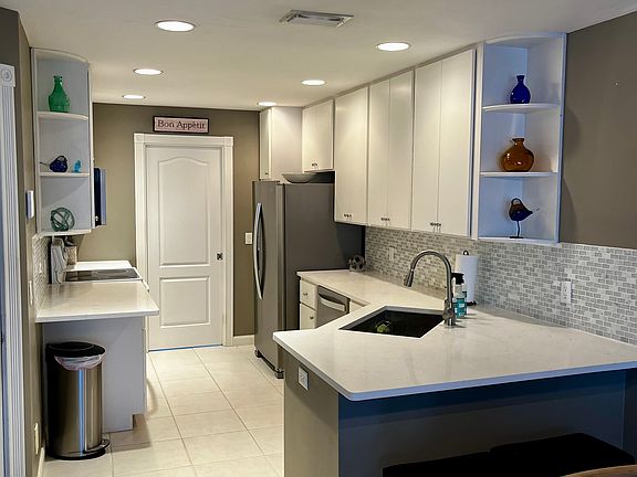 Kitchen Area. The closed pocket door leads to laundry room area.