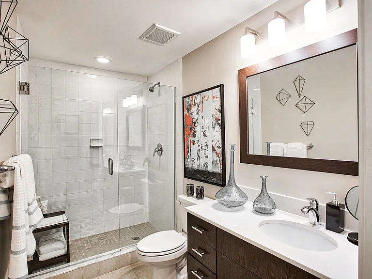 Generously appointed vanities in spacious modern bathrooms
