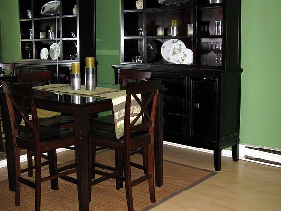 Dining space with mirrored wall.