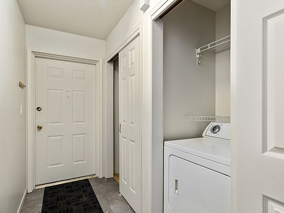 Entry hall, storage, and in unit laundry