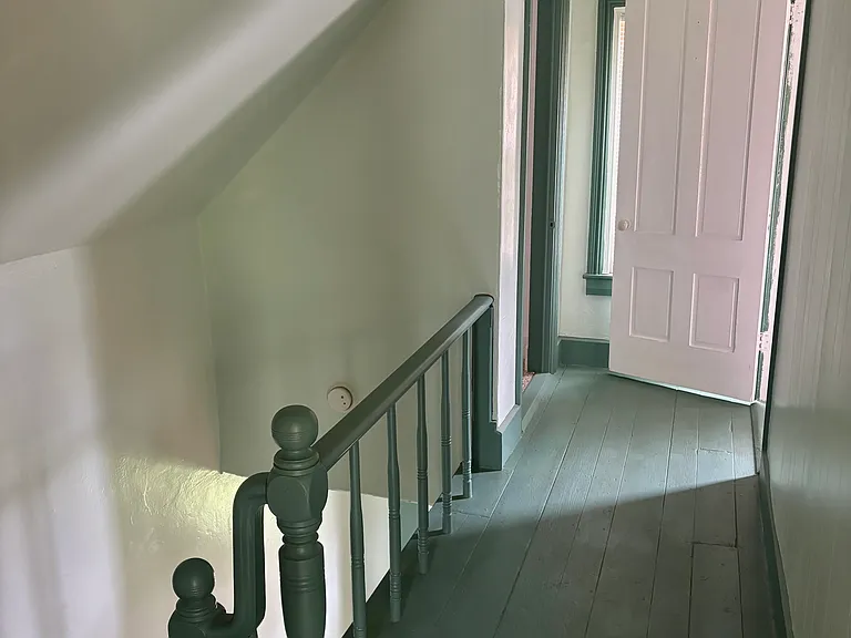top of stairwell facing upstairs second bedroom