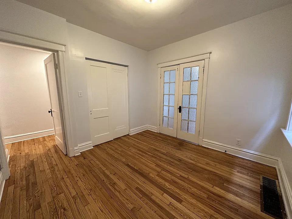 Bedroom hardwood floors, oversized closet with double storage, opens into living room if desired.