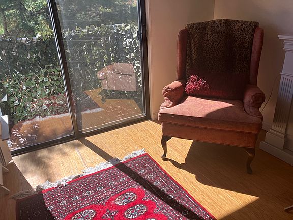 Living area showing balcony door and exterior balcony.