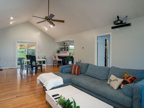 Living Area into Dining, Kitchen, and Primary Bedroom