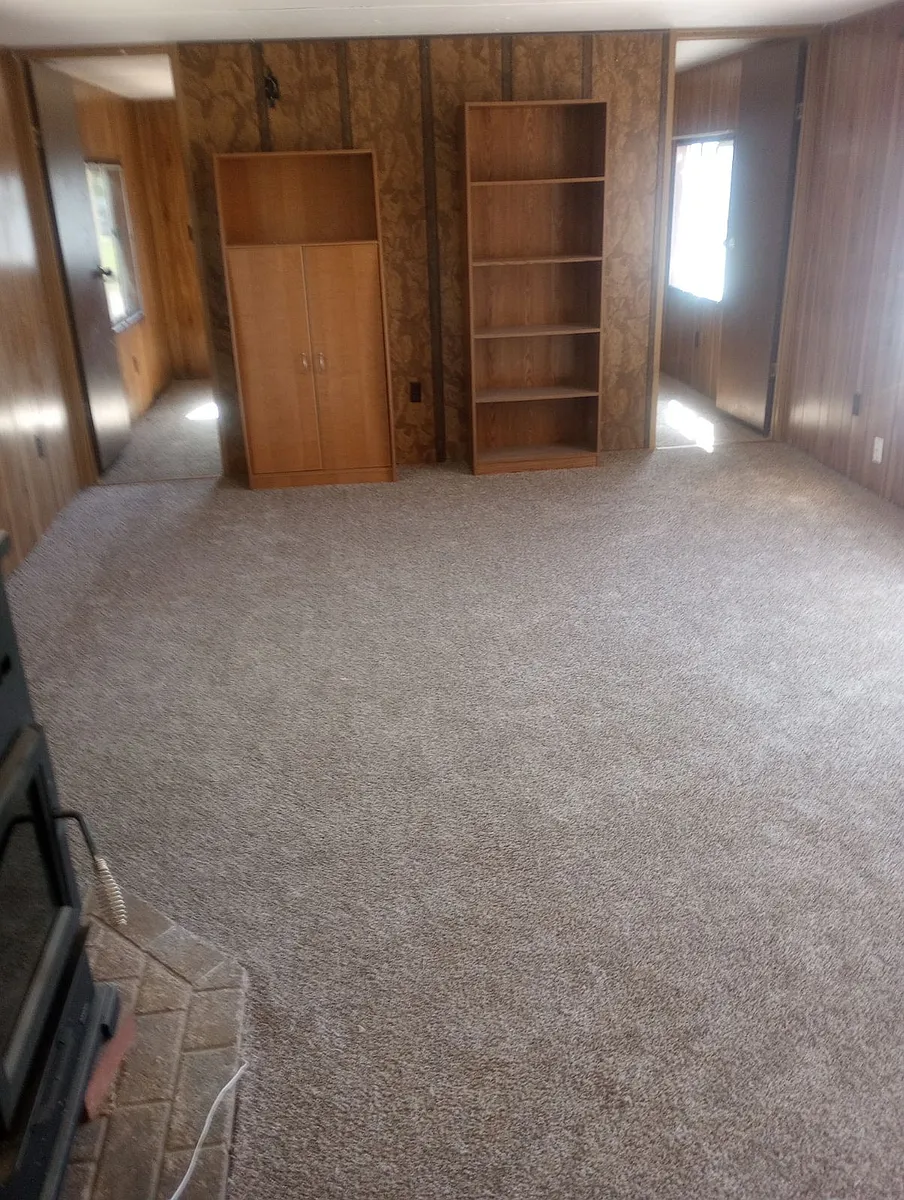 Living Room with pellet stove - 105 N Spokane St #9