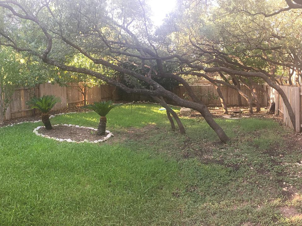 Wonderfully shaded backyard with tree hooks for a swing and many nice spots for a firepit set up or hammock.