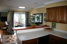 Eat-In breakfast area with custom made wood breakfast bar. Walkout to new deck