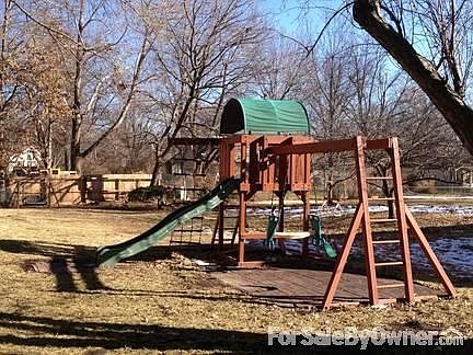 Playset in large backyard