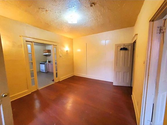 This property is located on the first floor. As you walk through, you will enter a hallway big enough for a living room.