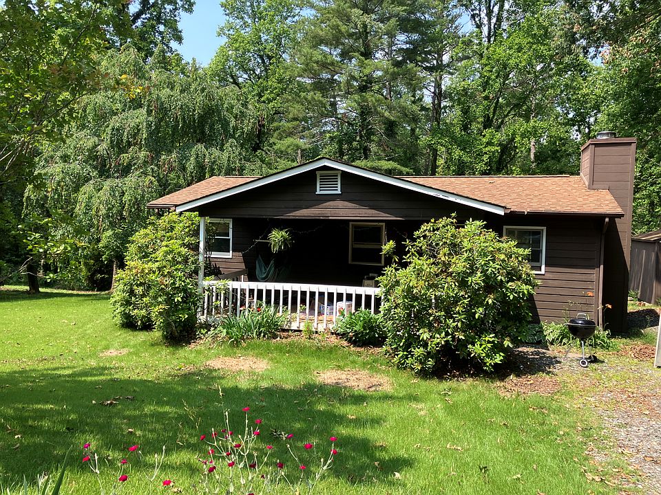 Front of house with shady covered front porch.