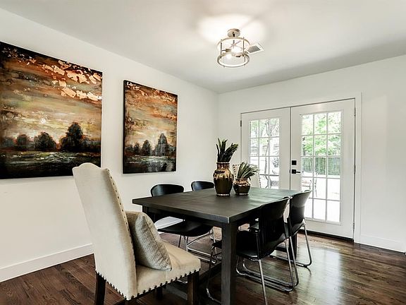 Dining area is large and the French doors overlook the huge backyard
