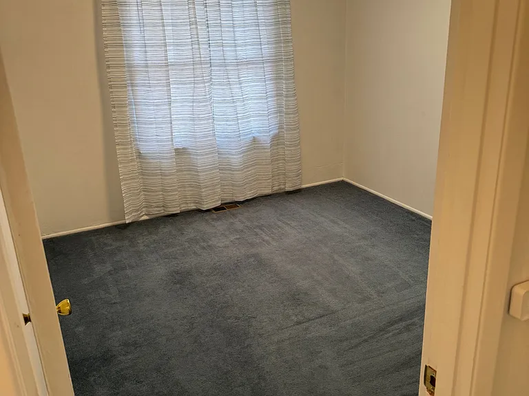 Master Bedroom, Full Closet, A/C window unit (included) not shown in picture. full closet, storage shelf with large doors.