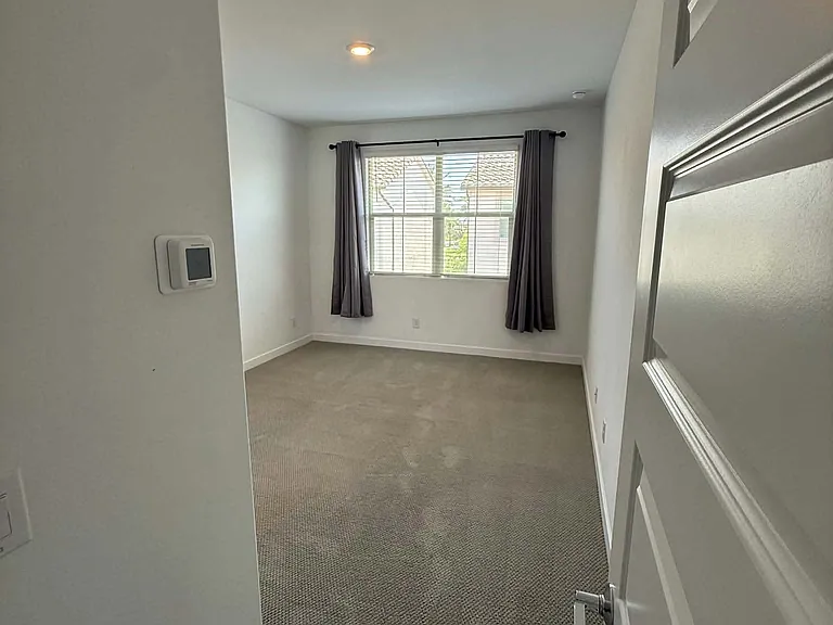 Large (11'6"x14) Bedroom with lots of light. Or close the room darkening curtains to shut the light out.