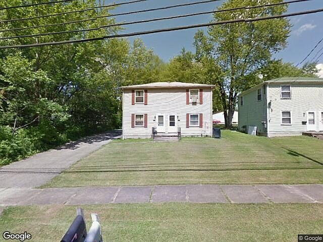 This duplex sits on a quiet lane across from the Mahoning River.