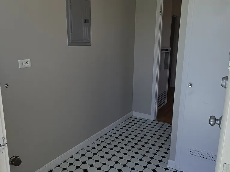Storage area and panty closet outside of kitchen