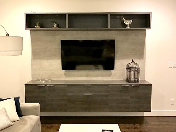 Custom built-in media center with additional storage.