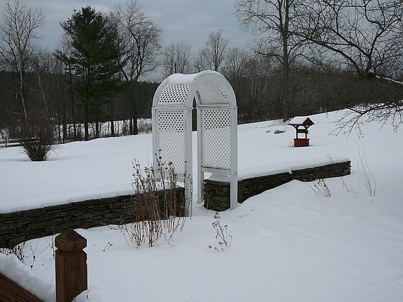 Front yard trellis & gardens