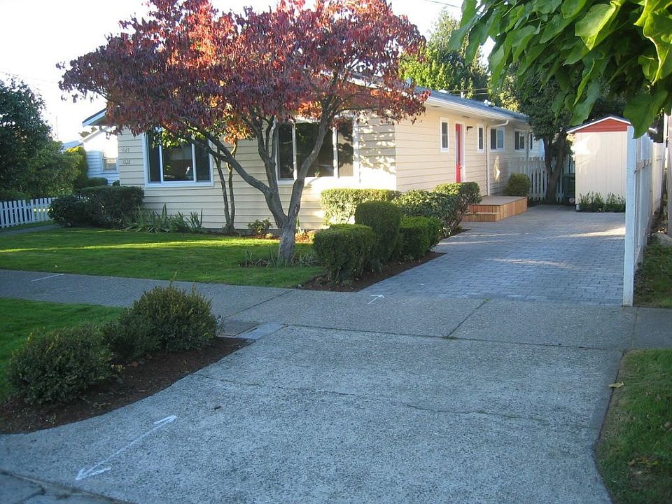 Front of house with 2 car parking & storage shed