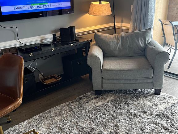 Living Room Chair. Smart TV with cable