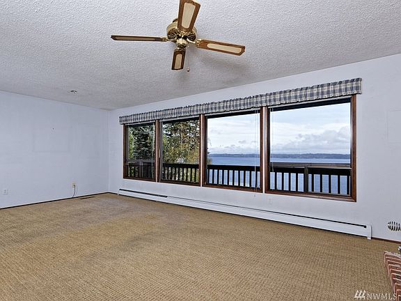 This is the main living room and that spectacular view.  Mt. Rainier was not out this day, but it is prominently straight out in front when it is!