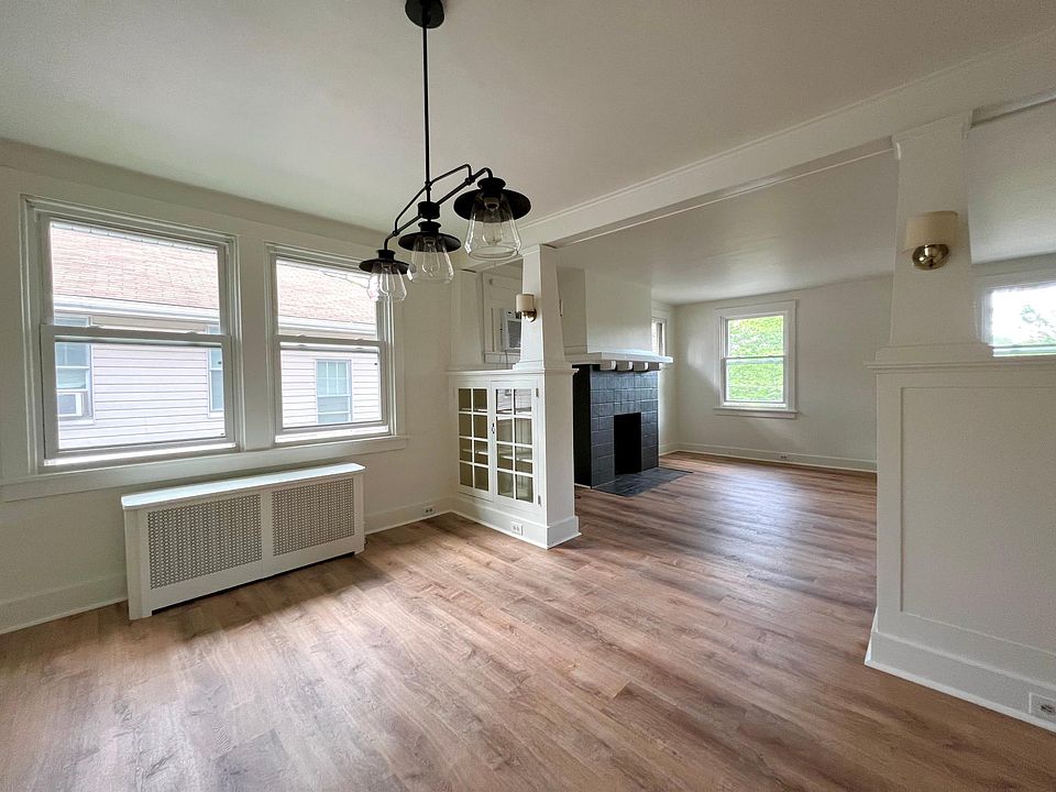Bright spacious dining and living room combination with original built ins
