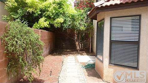 view of patio area & rear of home