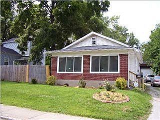 Lovely updated home with huge 6 car garage, nice sun room on front