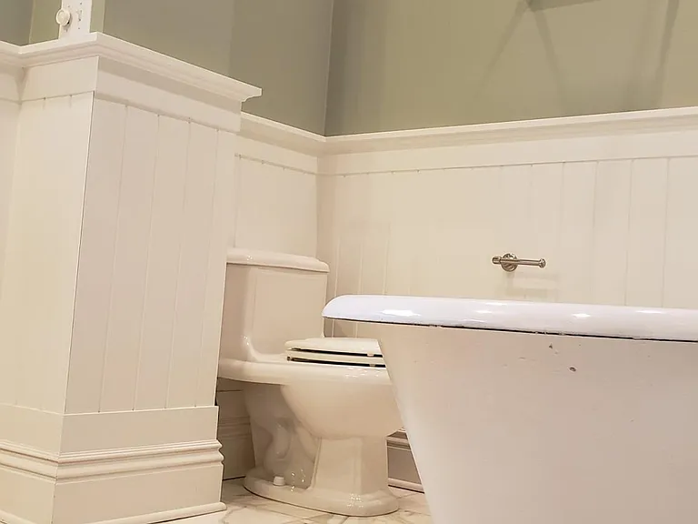 Turn of the century clawfoot tub and shower.