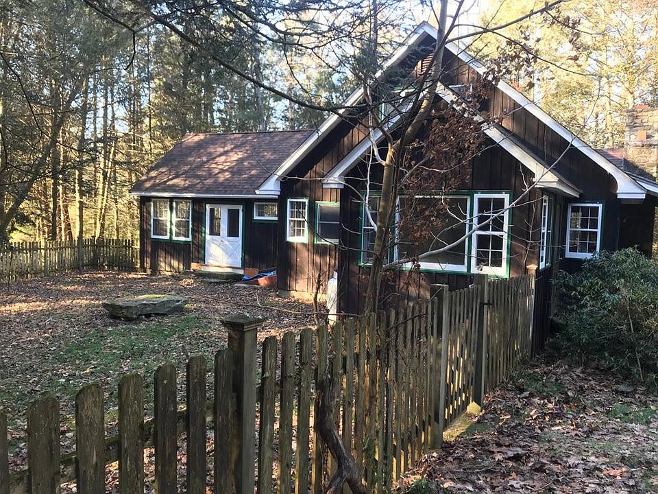 The side of the house with the fenced in yard