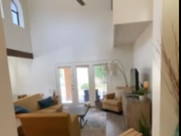 Living room with vaulted ceilings and lots of natural light