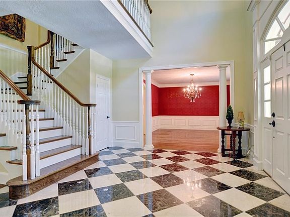 As you enter this home the formal dining room is to the right of the front door.  Two story entry way with a ceramic tile floor.