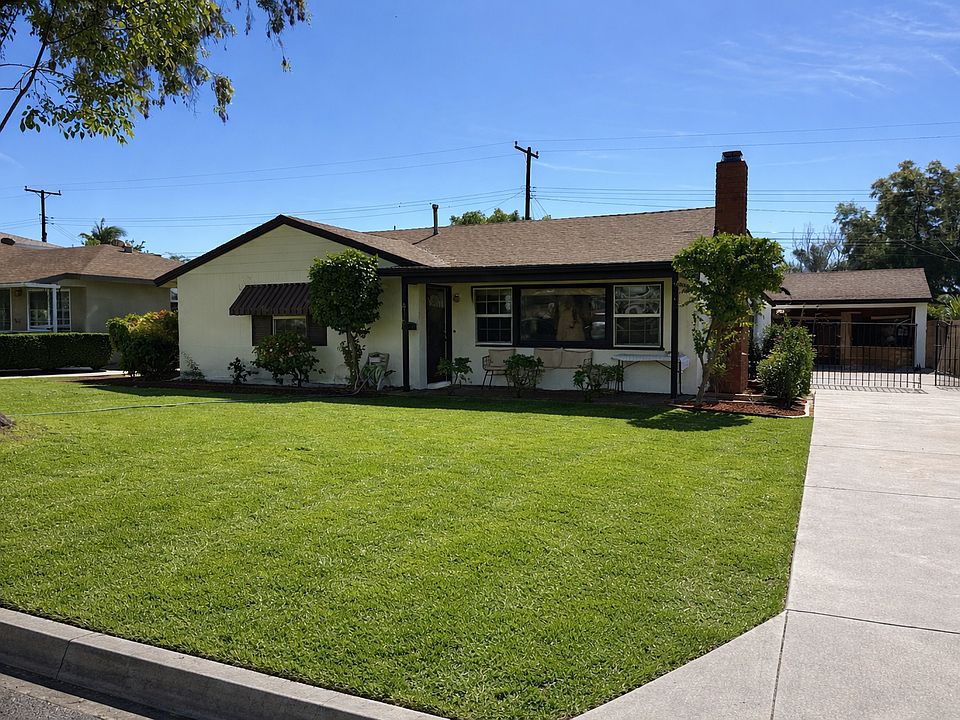 Front yard with lovely shade tree.
