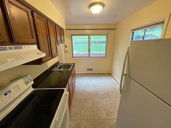 Kitchen with granite countertop.