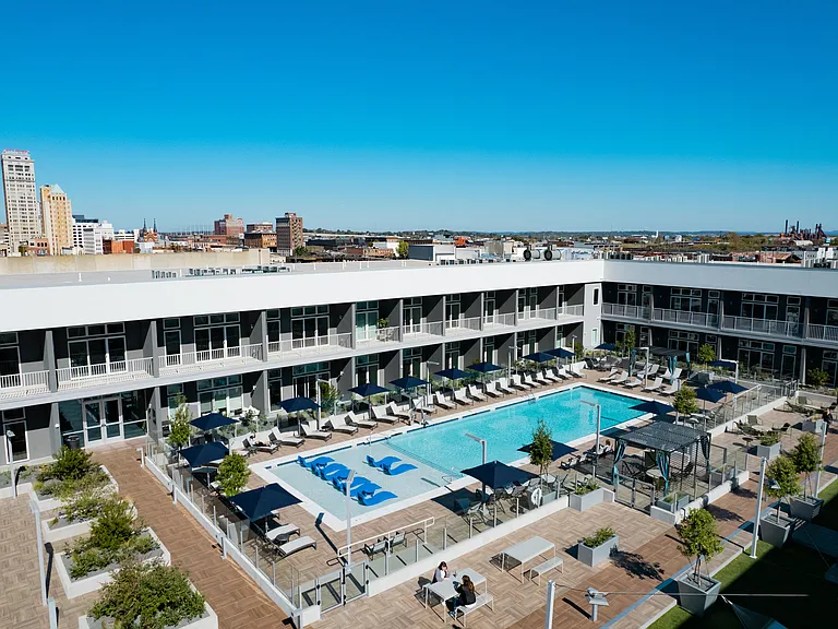 Building 3 Rooftop Amenity Deck with Pool/Cabanas, Yard Games, and Dining Spaces