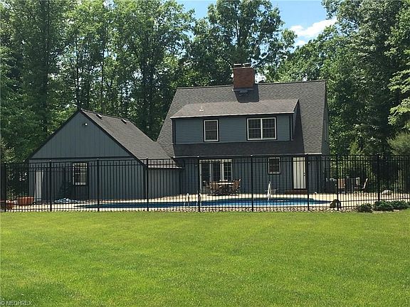 Beautifully fenced in ground pool with cement patio. This yard has plenty of space to utilize the backyard as well.