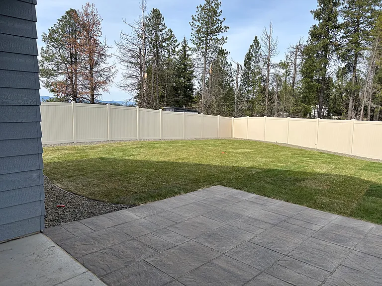Left side of back yard and patio