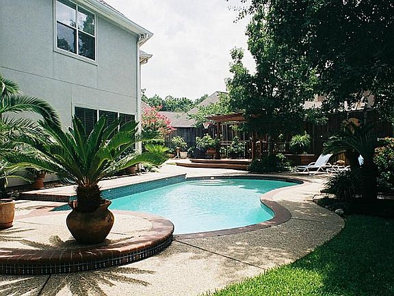 The pool is placed just behind the master bedroom and formal living area for maximum viewing and beauty.