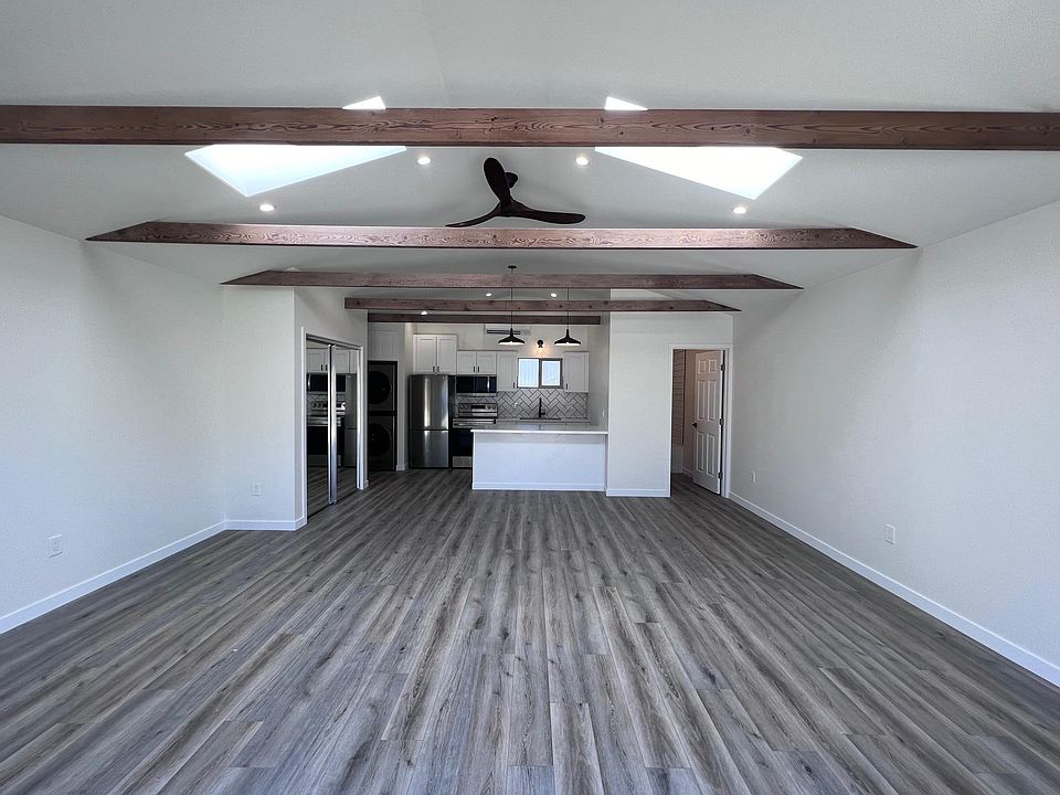 Living space looking into kitchen and bathroom