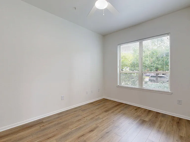 Spacious apartment Bedroom with wood style floor.