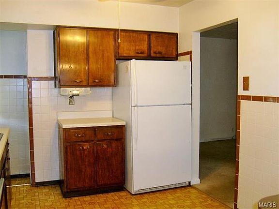 Wood cabinets in kitchen.