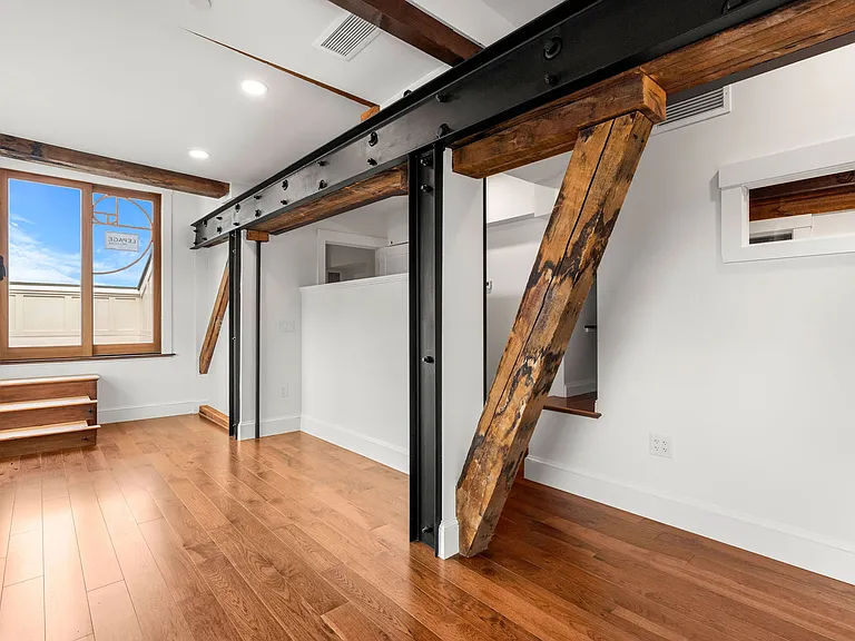 Another View of Penthouse Master Bedroom and exposed beams