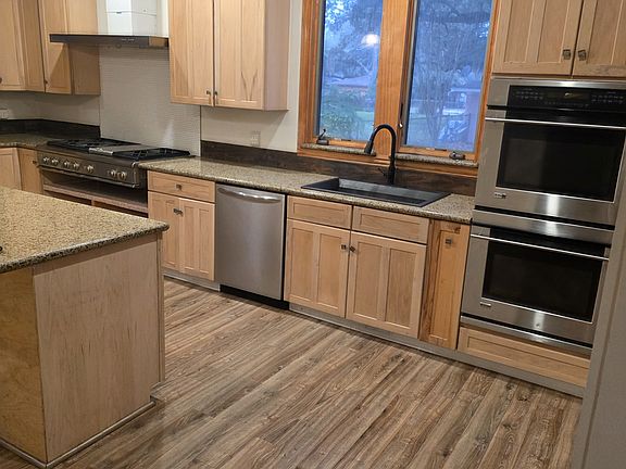 Stainless steel, 6-burner gas cooktop and large center island, all granite countertops and lots of upper and lower storage cabinets