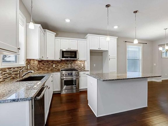 CHEF'S KITCHEN WITH JENN-AIRE APPLIANCES.