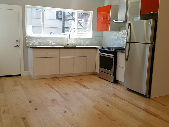 Light filled, new kitchen with door to deck.